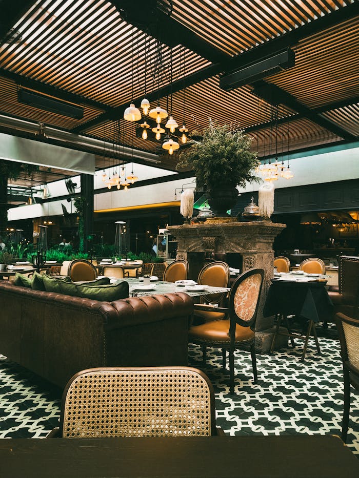 A luxurious indoor restaurant featuring classic decor with elegant wooden furniture and soft lighting.