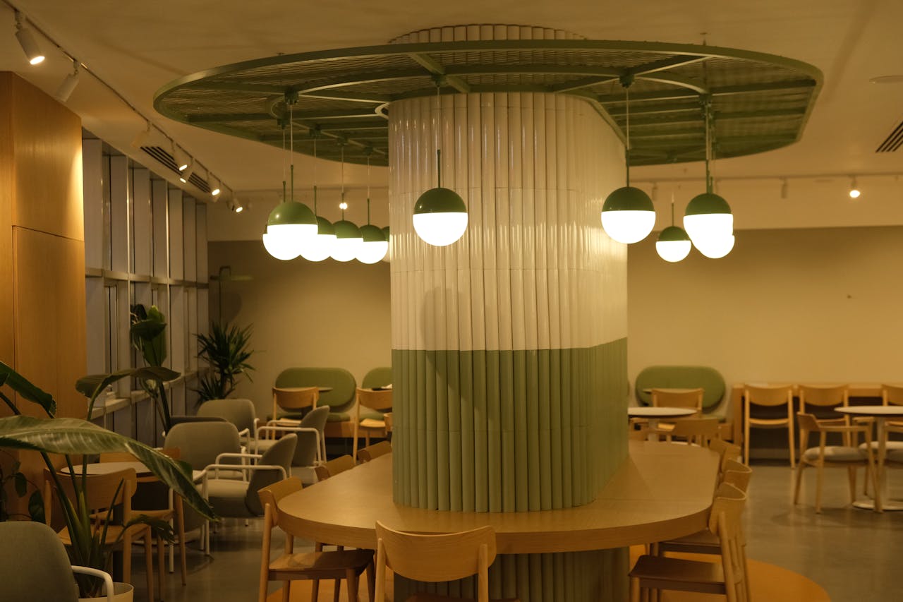 services-02 Contemporary restaurant interior featuring stylish green and white lighting design.