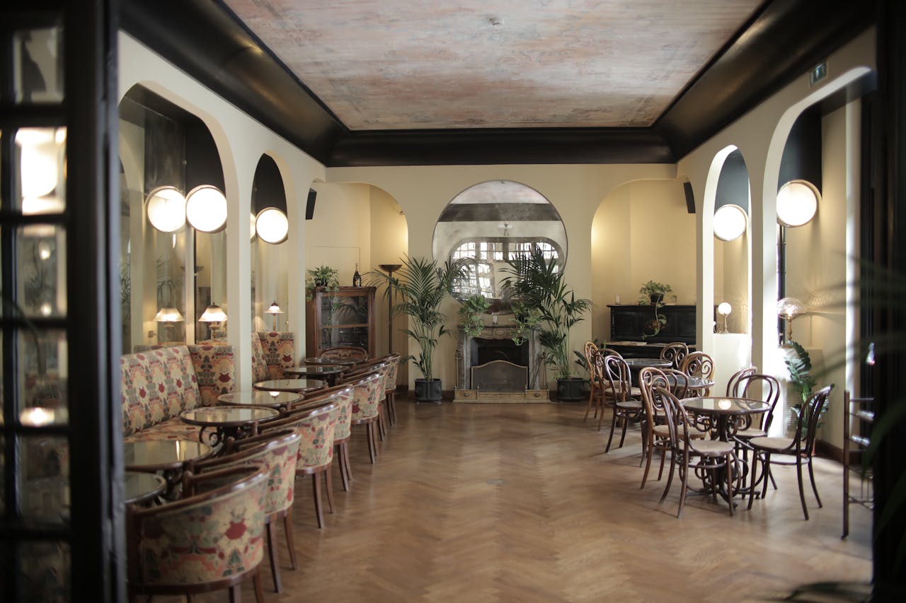 services-bg Charming dining room interior with vintage furniture and elegant lighting, creating a cozy atmosphere.